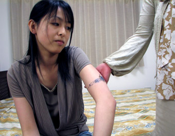 TATOO ON HER ARM